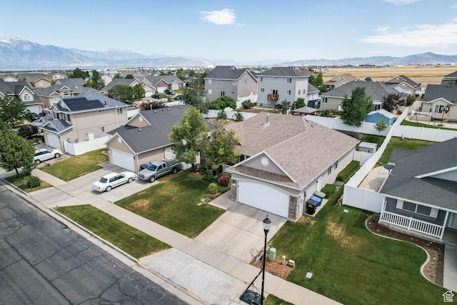 6743 W Spring Oak Dr, West Jordan, UT 84081 - aerial perspective of suburban area with a mountain backdrop