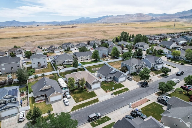 6743 W Spring Oak Dr, West Jordan, UT 84081 - aerial perspective of suburban area with a mountain backdrop