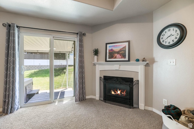 6743 W Spring Oak Dr, West Jordan, UT 84081 - carpeted living area with a fireplace with flush hearth and baseboards