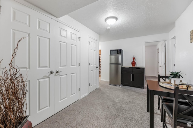 6743 W Spring Oak Dr, West Jordan, UT 84081 - dining room with light carpet and a textured ceiling