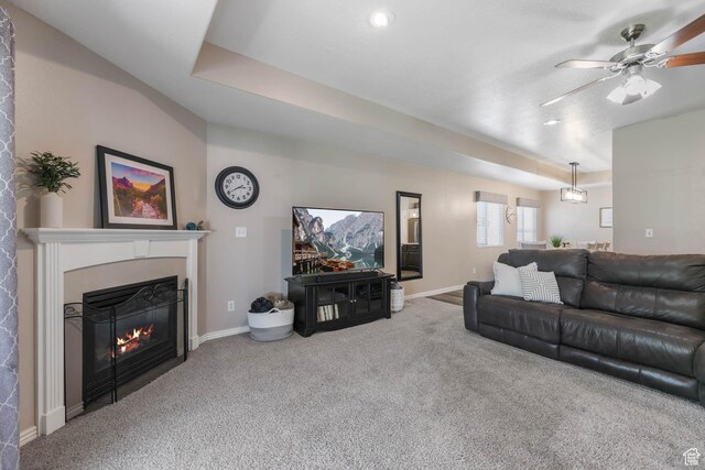 6743 W Spring Oak Dr, West Jordan, UT 84081 - living room featuring carpet, a glass covered fireplace, and ceiling fan