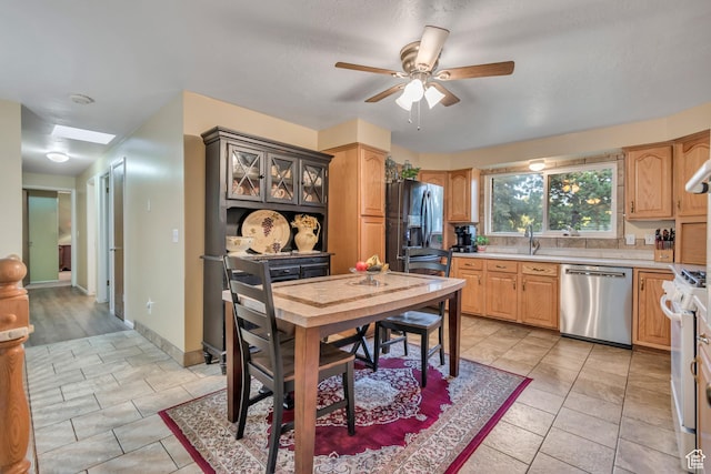955 W Charlotte Dr, South Jordan, UT 84095 - kitchen featuring dishwasher, refrigerator with ice dispenser, light countertops, ceiling fan, and white gas stove