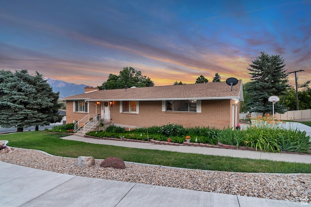 955 W Charlotte Dr, South Jordan, UT 84095 - single story home featuring brick siding, a lawn, and a chimney