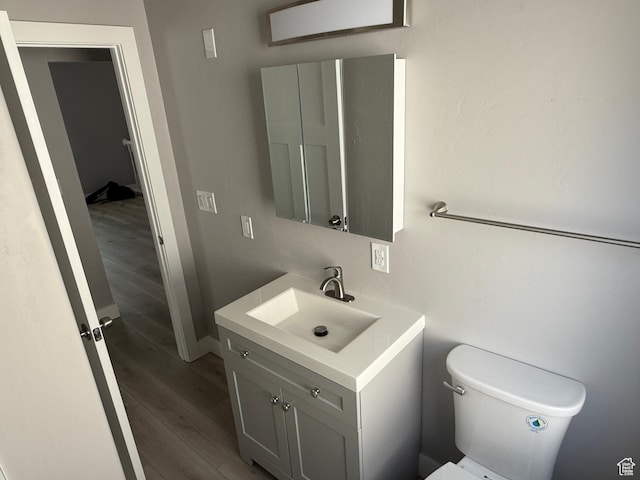 2327 S Custer E, Ogden, UT 84401 - bathroom featuring vanity and wood finished floors