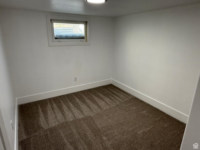 2327 S Custer E, Ogden, UT 84401 - empty room with dark carpet and baseboards