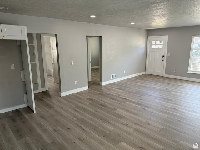 2327 S Custer E, Ogden, UT 84401 - foyer entrance featuring a textured ceiling, light wood-style flooring, and recessed lighting