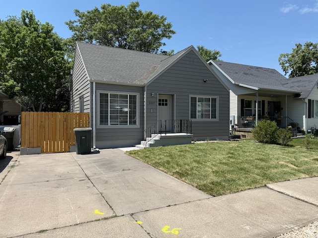 2327 S Custer E, Ogden, UT 84401 - view of front of house featuring roof with shingles