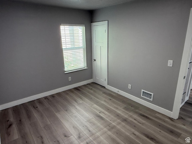 2327 S Custer E, Ogden, UT 84401 - unfurnished room featuring wood finished floors