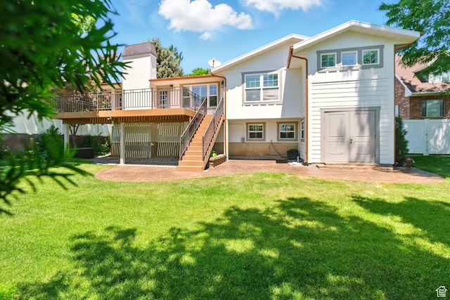 964 E Stewart Hill Dr, River Heights, UT 84321 - back of property featuring a wooden deck, stairway, board and batten siding, and a patio