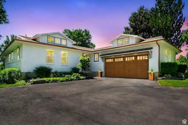 964 E Stewart Hill Dr, River Heights, UT 84321 - view of front of property with driveway, brick siding, and an attached garage