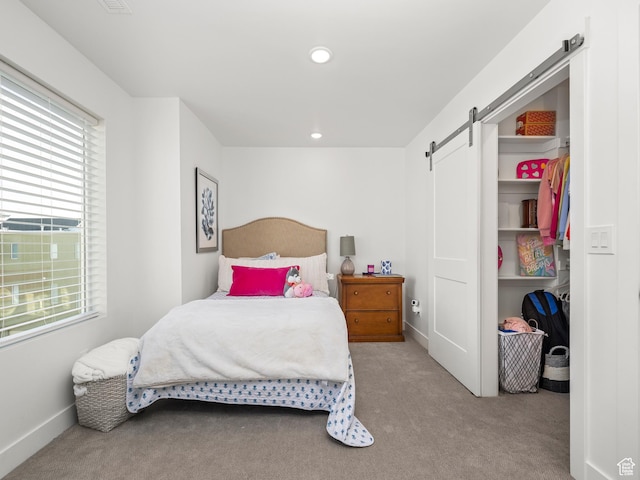 6191 W S Jordan Pkwy S Unit 286, South Jordan, UT 84009 - carpeted bedroom featuring a barn door, multiple windows, and recessed lighting
