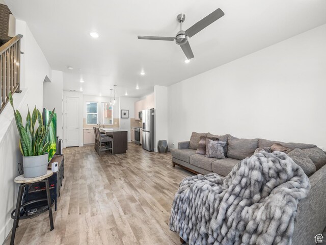 6191 W S Jordan Pkwy S Unit 286, South Jordan, UT 84009 - living room with light wood-style flooring, ceiling fan, recessed lighting, and stairway