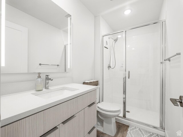 6191 W S Jordan Pkwy S Unit 286, South Jordan, UT 84009 - bathroom with vanity, a shower stall, wood finished floors, and recessed lighting