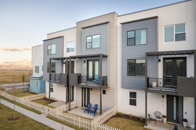 6191 W S Jordan Pkwy S Unit 286, South Jordan, UT 84009 - rear view of property with a balcony and stucco siding