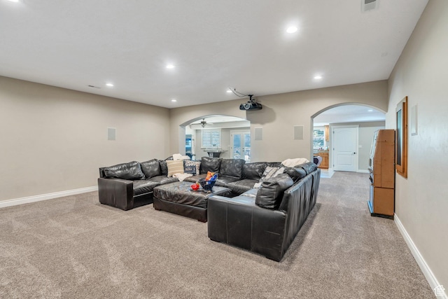 9967 N 6670 W, Highland, UT 84003 - living area featuring arched walkways, light colored carpet, recessed lighting, and ceiling fan