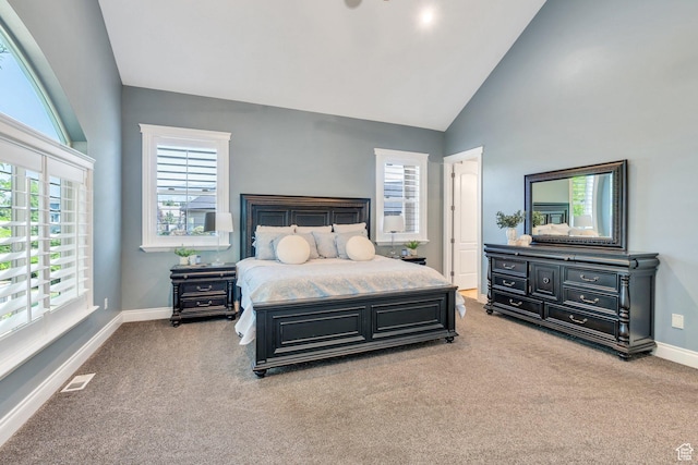 9967 N 6670 W, Highland, UT 84003 - bedroom featuring light colored carpet, multiple windows, and high vaulted ceiling