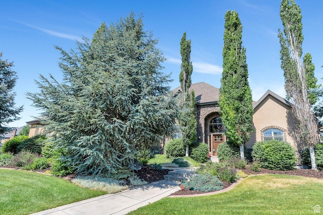 9967 N 6670 W, Highland, UT 84003 - view of front of home with a front yard and brick siding