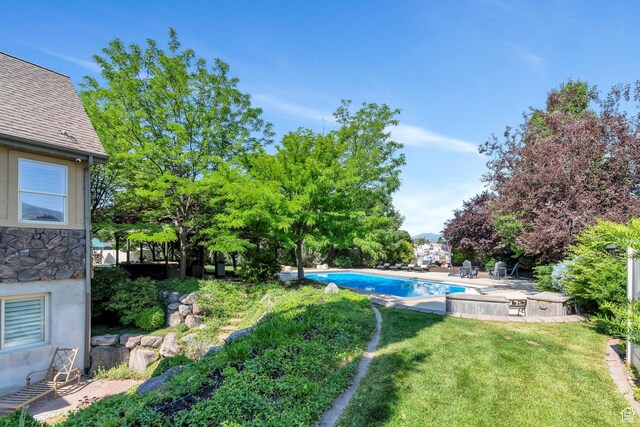 9967 N 6670 W, Highland, UT 84003 - view of green lawn featuring an outdoor pool and a patio area