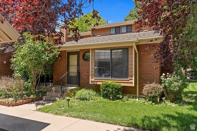 1423 S 1175 E Unit 1, Ogden, UT 84404 - view of front of property with brick siding and a front yard