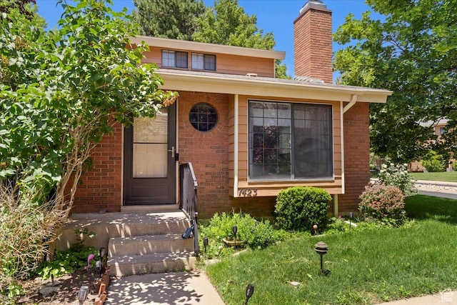 1423 S 1175 E Unit 1, Ogden, UT 84404 - view of front of home with brick siding and a chimney