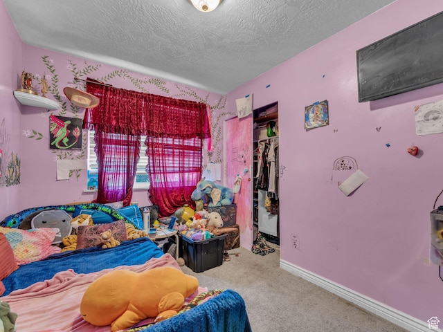 6126 S Middlewood Cir W, Salt Lake City, UT 84118 - bedroom with carpet flooring, a closet, a textured ceiling, and a spacious closet