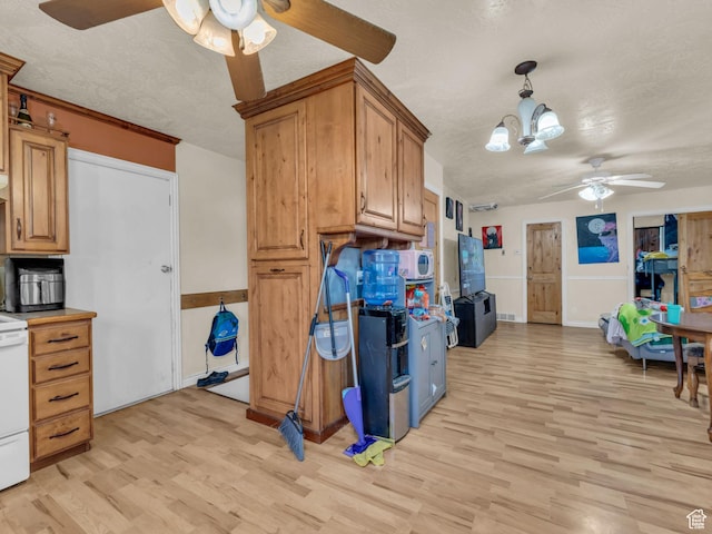 6126 S Middlewood Cir W, Salt Lake City, UT 84118 - kitchen featuring a ceiling fan, light wood-type flooring, a textured ceiling, and brown cabinetry