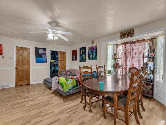 6126 S Middlewood Cir W, Salt Lake City, UT 84118 - dining area featuring light wood-style floors, ceiling fan, and a textured ceiling