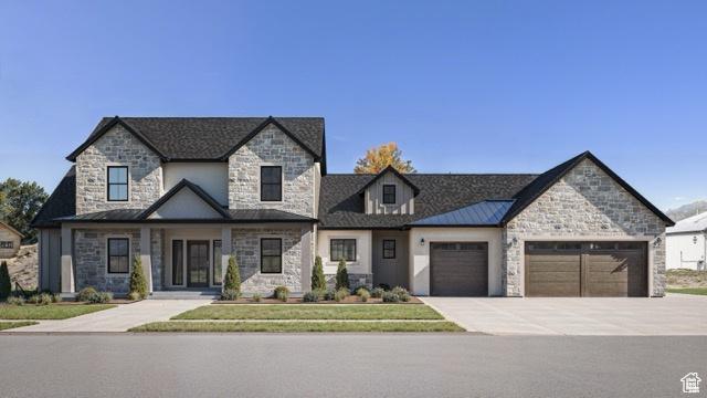 2881 Thirty Oaks Dr, Springville, UT 84663 - view of front facade with stone siding, an attached garage, and concrete driveway