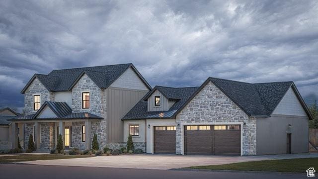 2881 Thirty Oaks Dr, Springville, UT 84663 - view of front facade featuring stone siding, a garage, concrete driveway, and a standing seam roof
