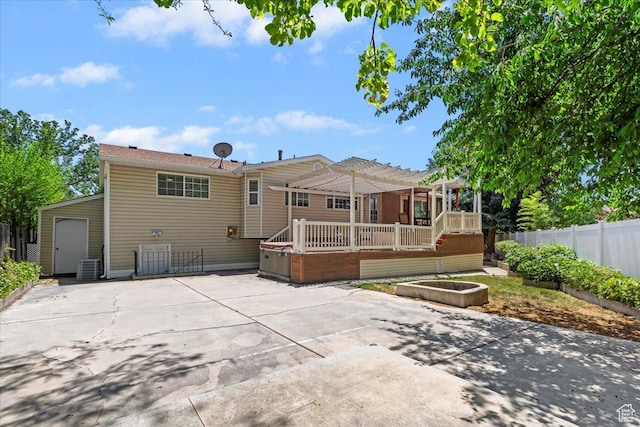 1430 W 6720 S, West Jordan, UT 84084 - back of house with a patio area, a pergola, a wooden deck, and concrete driveway