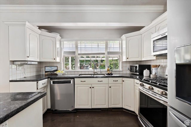 1430 W 6720 S, West Jordan, UT 84084 - kitchen with stainless steel appliances, white cabinets, tasteful backsplash, ornamental molding, and dark stone counters