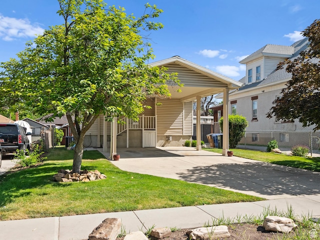 841 E Ramona Ave, Salt Lake City, UT 84105 - view of front of house featuring concrete driveway, a front lawn, and a carport