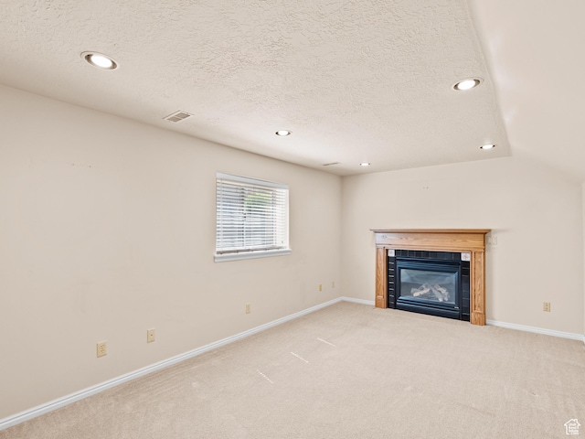 841 E Ramona Ave, Salt Lake City, UT 84105 - unfurnished living room with recessed lighting, a fireplace, carpet floors, and a textured ceiling