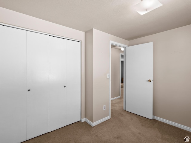 841 E Ramona Ave, Salt Lake City, UT 84105 - unfurnished bedroom with light colored carpet and a closet