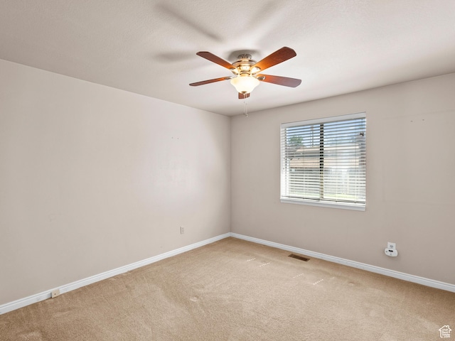 841 E Ramona Ave, Salt Lake City, UT 84105 - empty room with light colored carpet and a ceiling fan