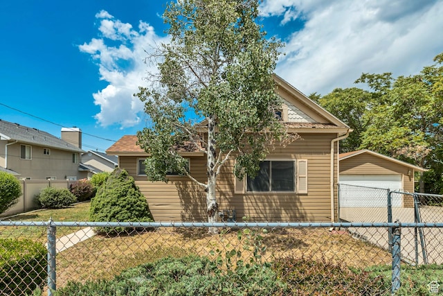 787 E 4800 S, Murray, UT 84107 - view of front facade featuring an outbuilding, a fenced backyard, and a detached garage