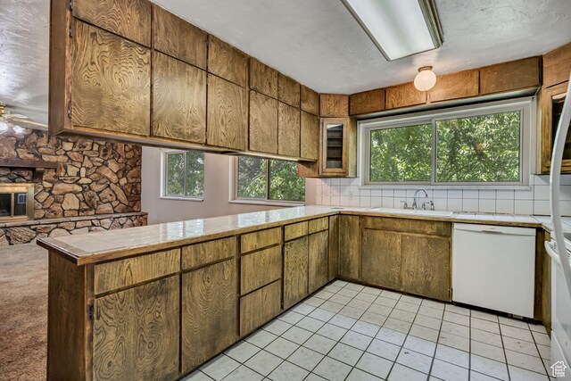 787 E 4800 S, Murray, UT 84107 - kitchen with white dishwasher, plenty of natural light, light tile patterned floors, and brown cabinetry