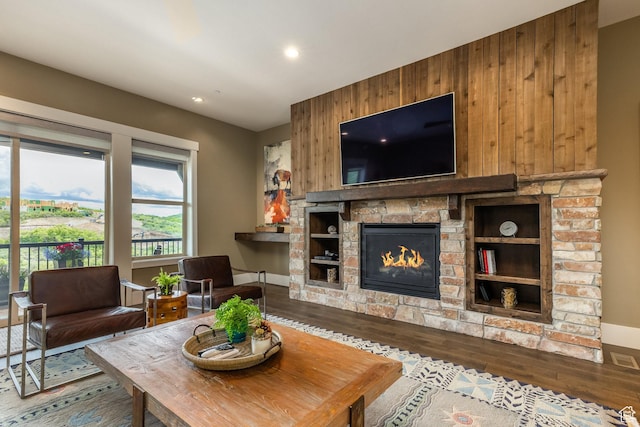 1773 E Longview Dr, Hideout, UT 84036 - living room featuring wood finished floors, wooden walls, a fireplace, and recessed lighting