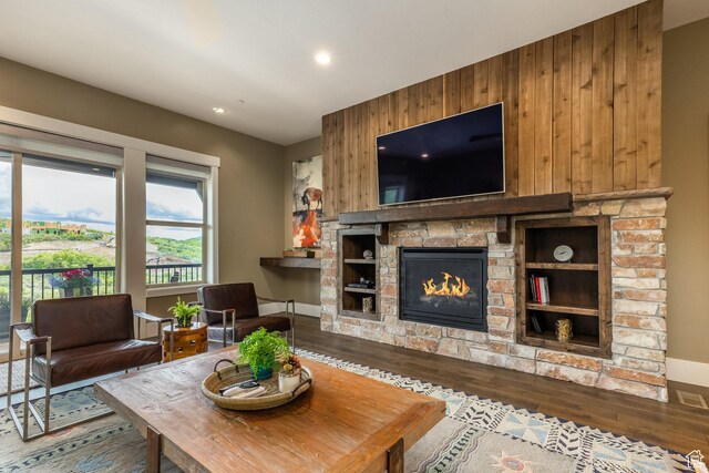 1773 E Longview Dr, Hideout, UT 84036 - living room featuring wood finished floors, wooden walls, a stone fireplace, and recessed lighting