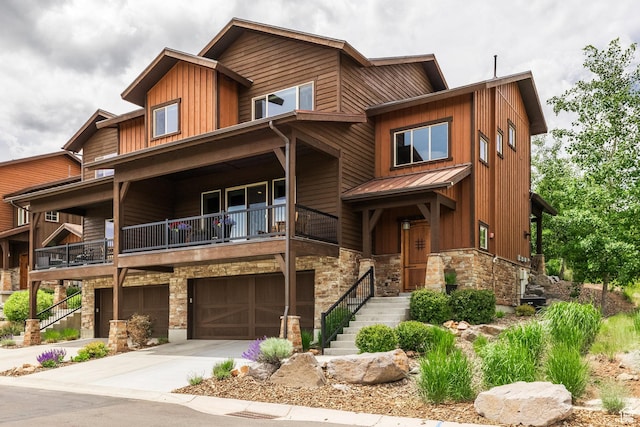 1773 E Longview Dr, Hideout, UT 84036 - view of front of property with stone siding, board and batten siding, a balcony, and an attached garage