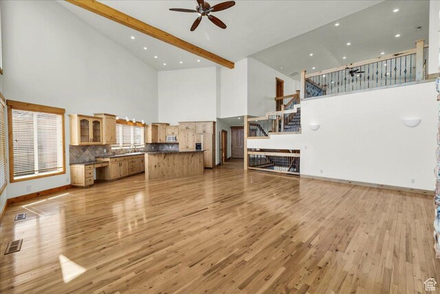 393 N Crestline Cir, St George, UT 84790 - unfurnished living room with high vaulted ceiling, ceiling fan, light wood-style flooring, stairway, and recessed lighting