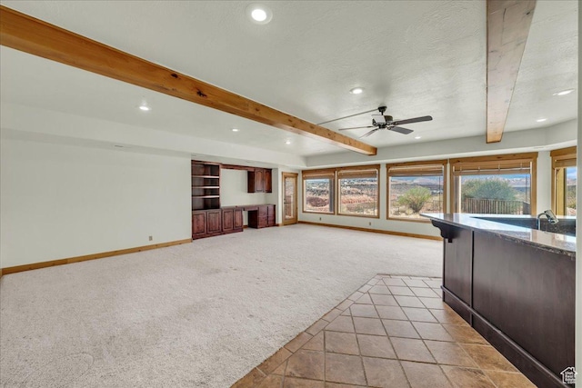 393 N Crestline Cir, St George, UT 84790 - unfurnished living room featuring light colored carpet, beamed ceiling, recessed lighting, a ceiling fan, and a textured ceiling