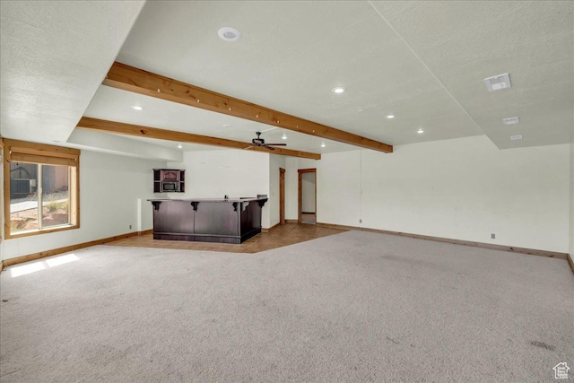 393 N Crestline Cir, St George, UT 84790 - unfurnished living room featuring recessed lighting, bar area, carpet floors, beam ceiling, and ceiling fan