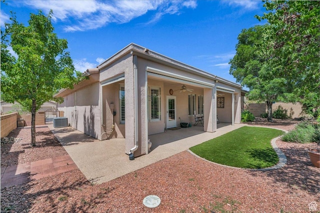 1621 W Wonderstone Dr, St George, UT 84790 - back of property featuring stucco siding, ceiling fan, a fenced backyard, and a patio area