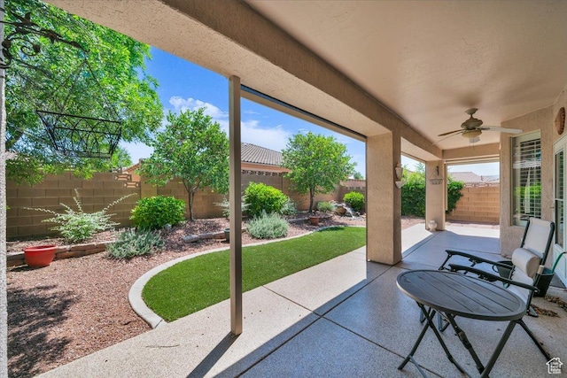 1621 W Wonderstone Dr, St George, UT 84790 - fenced backyard with a ceiling fan and a patio area