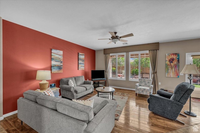 1621 W Wonderstone Dr, St George, UT 84790 - living area with plenty of natural light, wood finished floors, and a ceiling fan