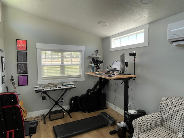 2156 W 4750 N, Roosevelt, UT 84066 - home office featuring vaulted ceiling, wood finished floors, and a wall mounted air conditioner