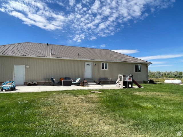 2156 W 4750 N, Roosevelt, UT 84066 - rear view of property with entry steps, a patio, a lawn, and a metal roof