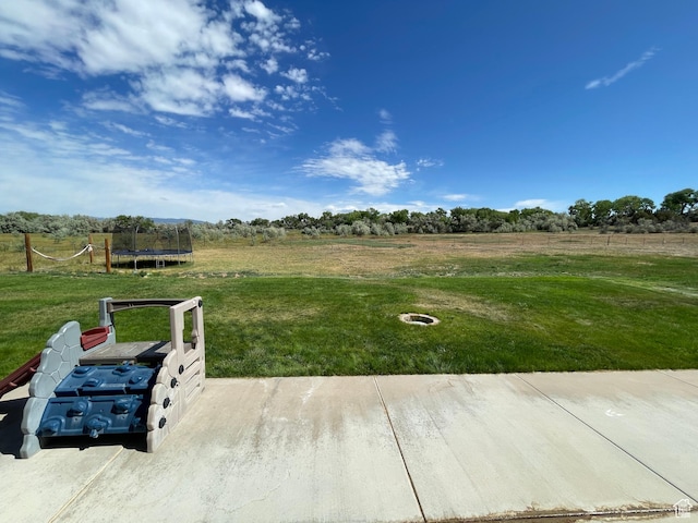 2156 W 4750 N, Roosevelt, UT 84066 - view of green lawn with a trampoline and a view of countryside