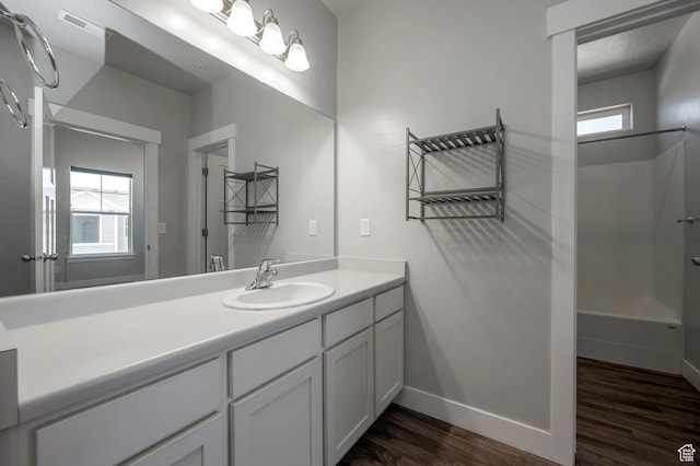 55 W Silver Springs Dr Unit F, Vineyard, UT 84059 - bathroom with wood finished floors, vanity, and plenty of natural light
